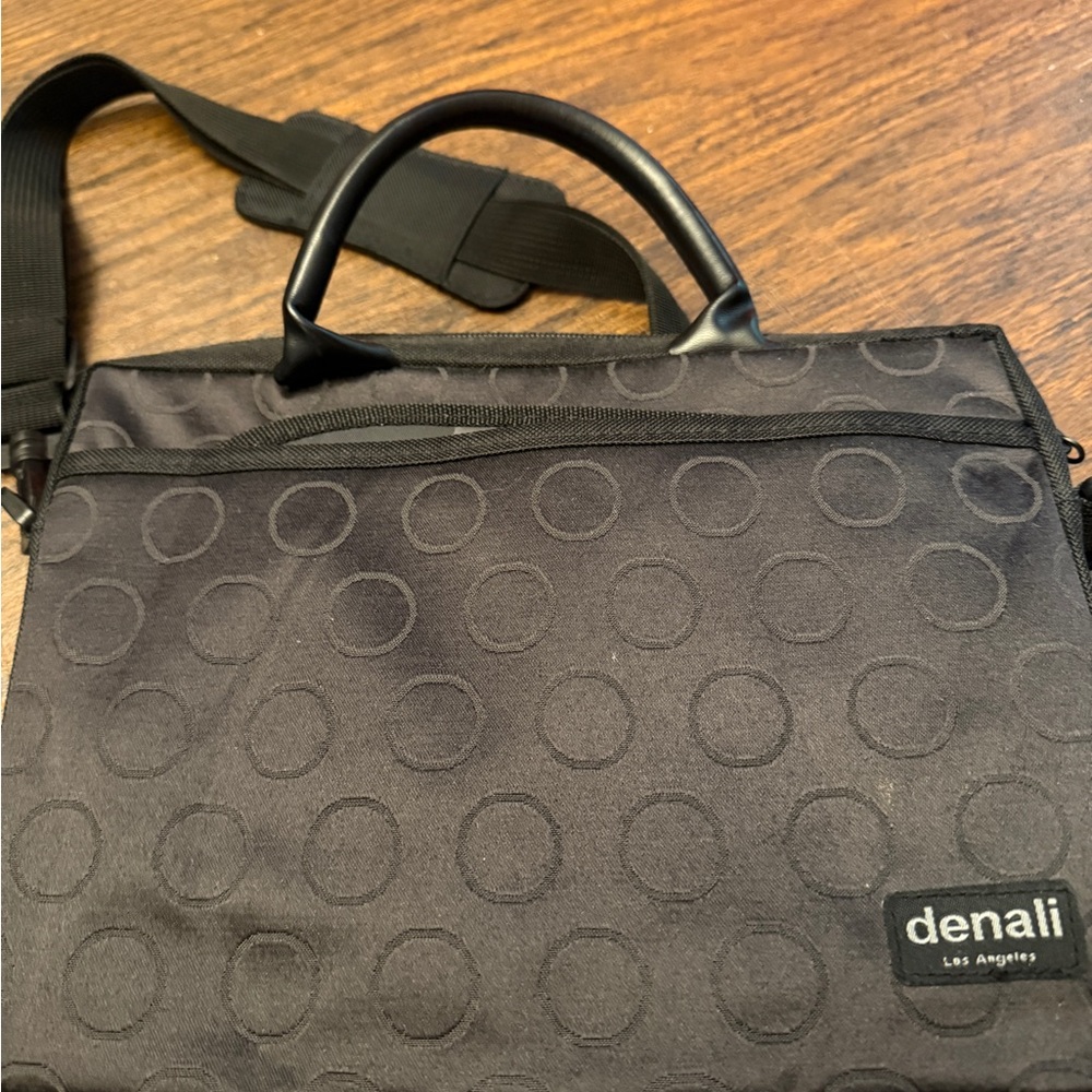 Black Laptop Case with Circular Pattern and Minimalist Design